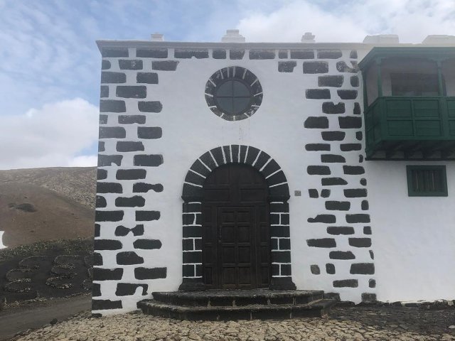 Fair-faced masonry and arched portal